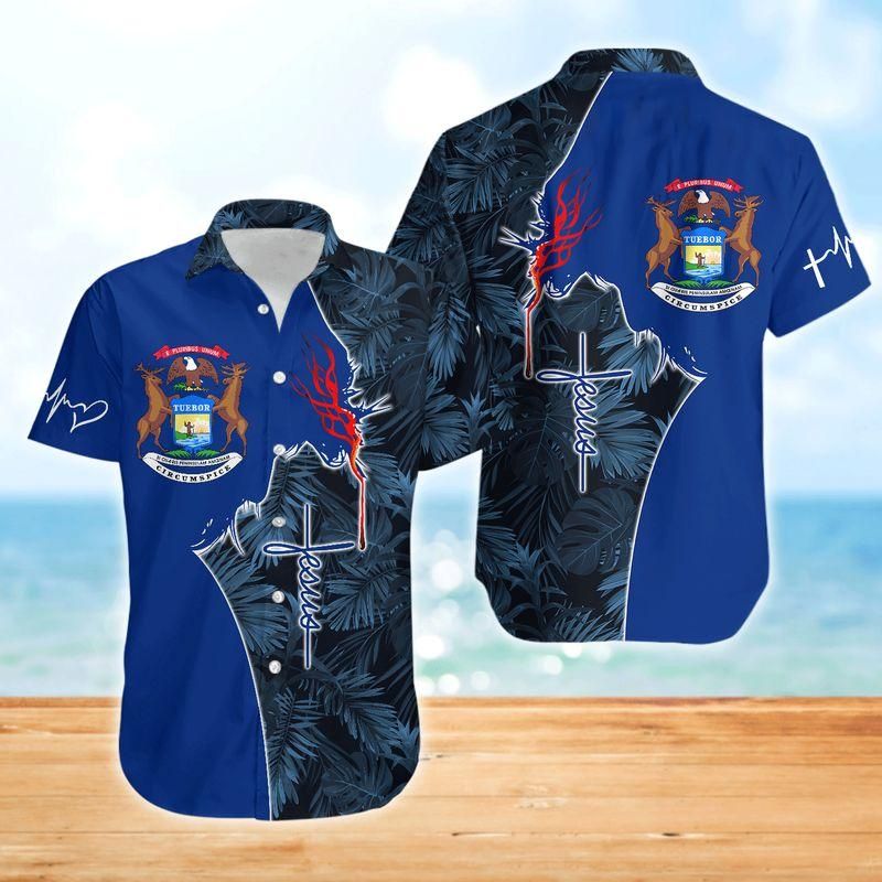 Blue Hawaiian button-up with tropical leaves and chest cross graphic (unisex).