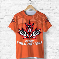 Orange T-shirt with black and white eagle/head graphic and 'EVERY CHILD MATTERS' text