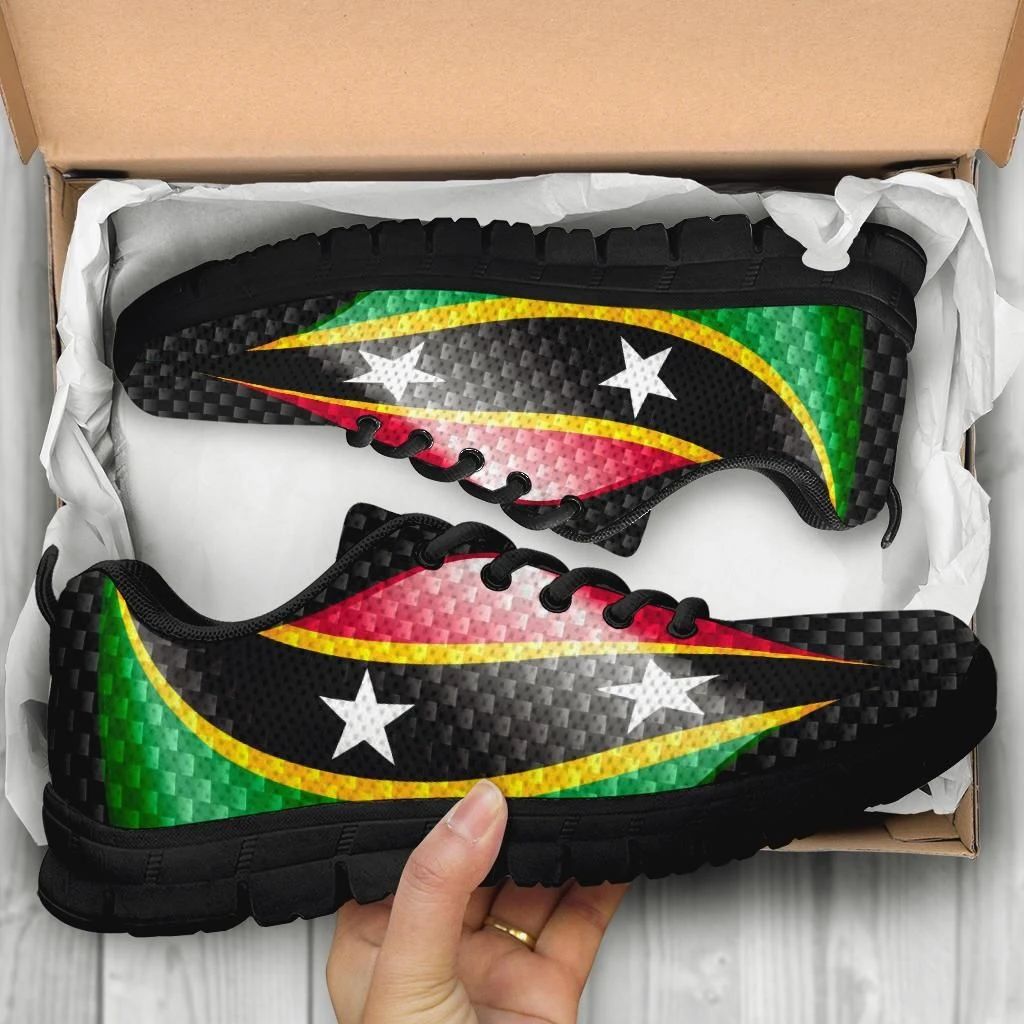 Pair in box: black sneakers with flag print, white star motifs, chunky tread sole