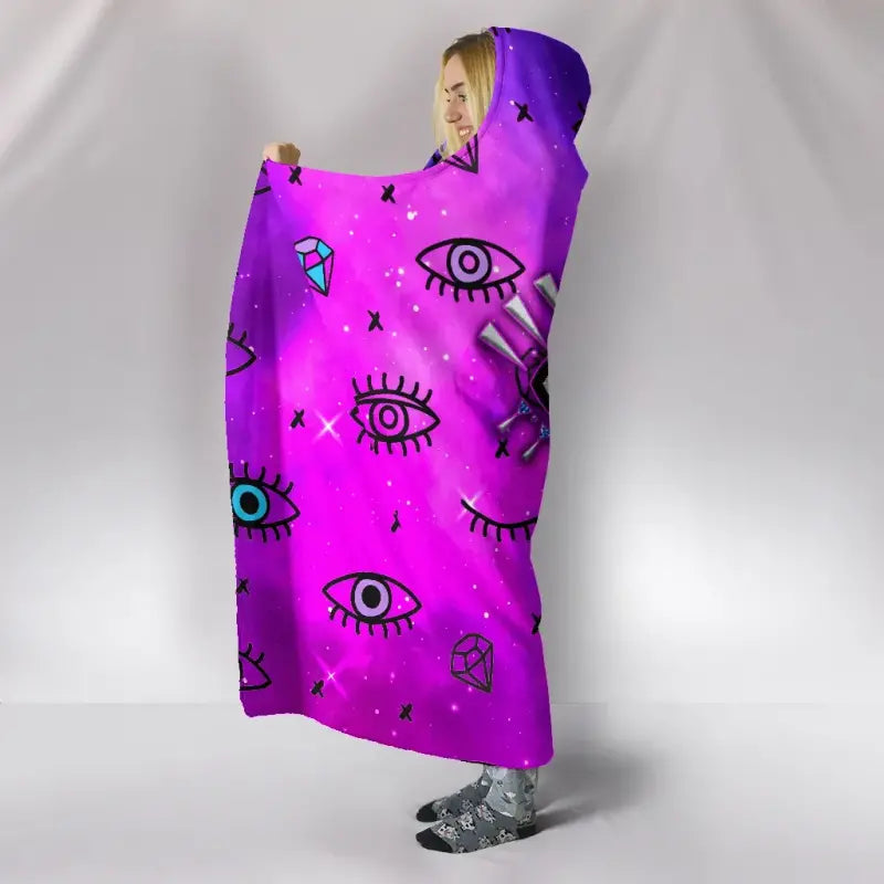 Purple hooded blanket with evil-eye and diamond graphics, draped with hood raised