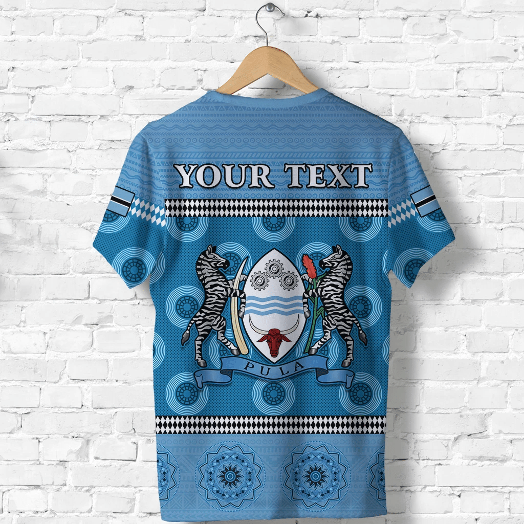 Blue T-shirt back: 'YOUR TEXT' lions crest with gear and banner