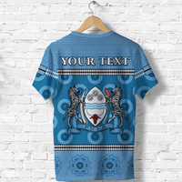 Blue T-shirt back: 'YOUR TEXT' lions crest with gear and banner