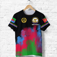 Black T-shirt with ERITREA logo and two circular emblems; flag stripe accents on sleeves