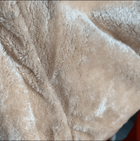 Light beige plush fabric texture from inside hooded coat