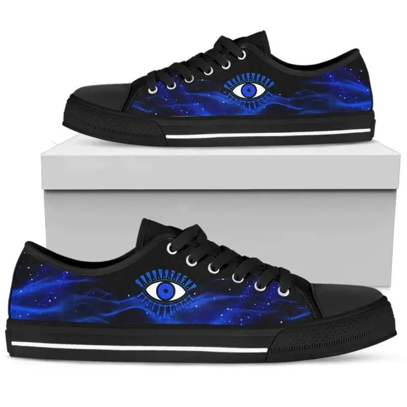 Blue evil eye low top sneakers, black upper with blue galaxy print and white sole stripe.