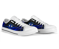 Pair of white low top sneakers with blue galaxy evil eye print and black stripe.