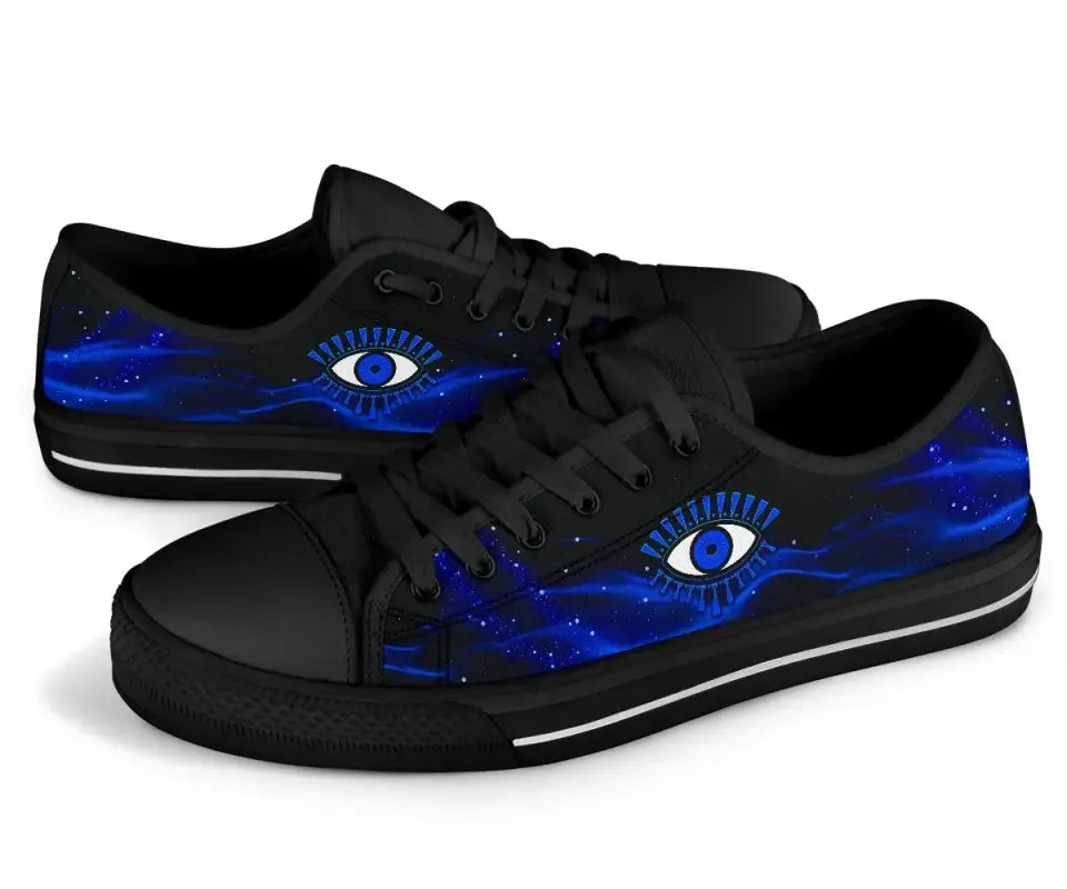 Black low top sneakers with blue galaxy evil eye graphic and black lace-up upper.
