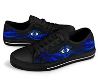 Black low top sneakers with blue galaxy evil eye graphic and black lace-up upper.