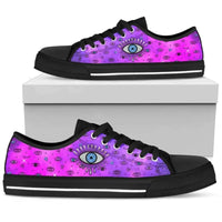 Pink low-top sneakers with evil eye print, black lace-up front, on white display box