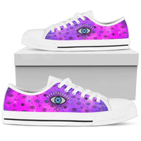 Pink low-top sneakers with evil eye print, white laces, shown on white box