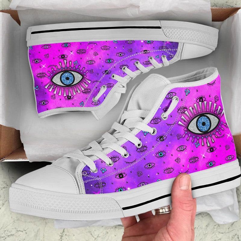 Pink high-top sneakers with white laces and evil eye graphic on side