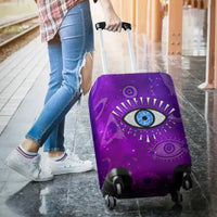 Purple fitted luggage cover on spinner suitcase, evil eye and galaxy-like print