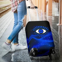Blue and black evil eye luggage cover on an upright rolling suitcase