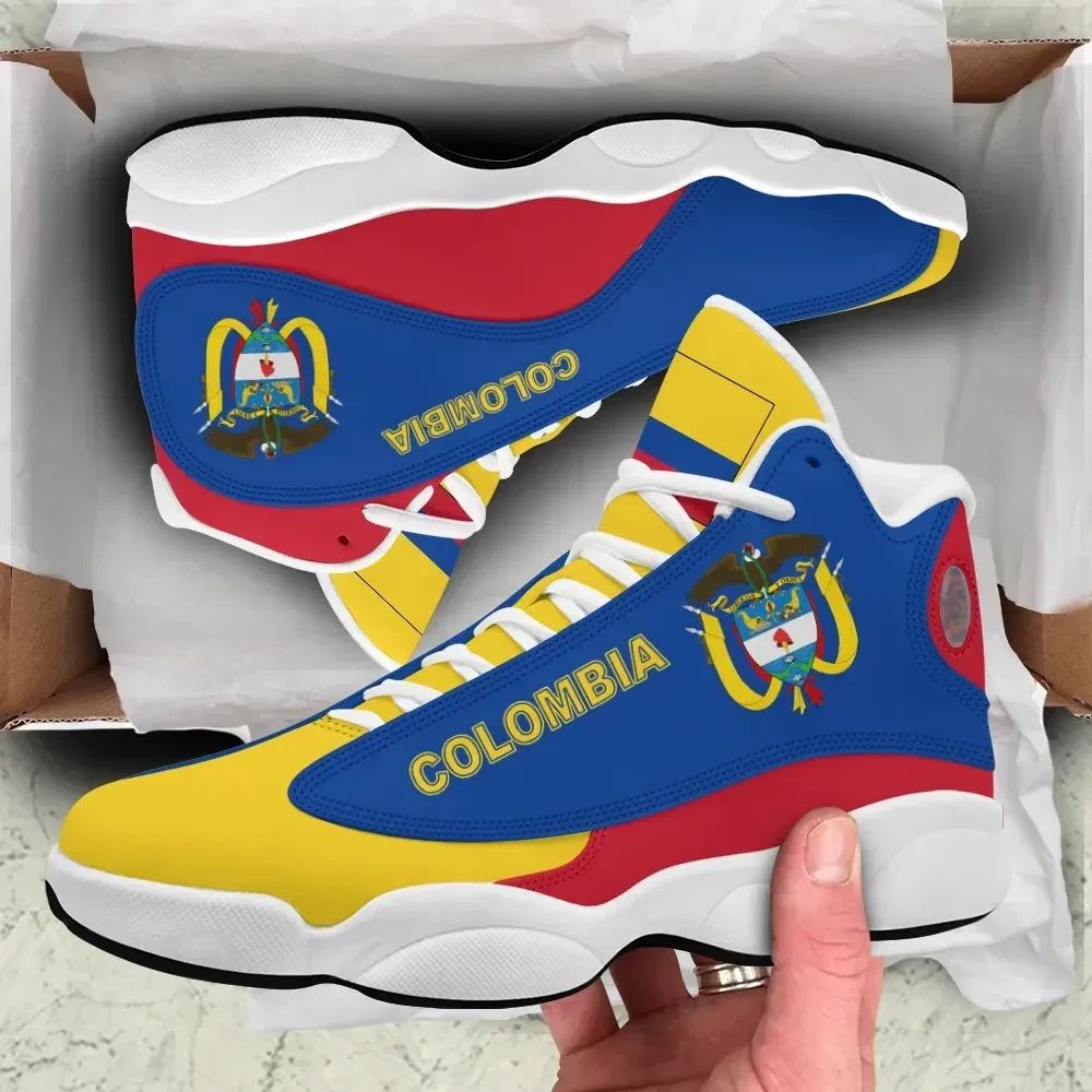 Blue high-top sneakers with Colombia emblem, yellow accents, red heel, white sole