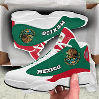 Green high-top sneakers, red heel panel and stripe, MEXICO text, white rubber sole