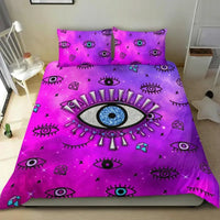 Pink duvet cover featuring a large blue evil eye emblem with smaller eyes and stars