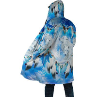 Side view of blue all-over printed hooded coat with wolf faces and feather dreamcatchers