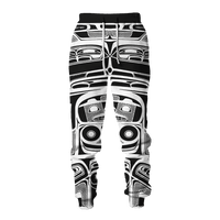Back view of black-and-white all-over tattoo print sweatpants with elastic waistband