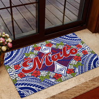 Blue “Malo” door mat with tropical flowers and green leaf accents near the entry