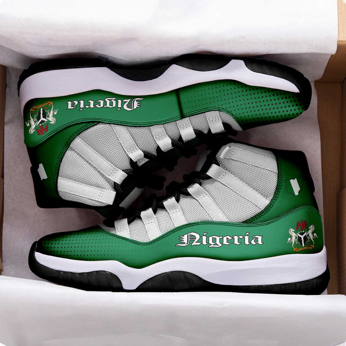 In-box view: green Nigeria high-top sneakers with white mesh, black laces, thick white sole