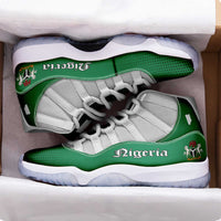 Green Nigeria sneakers with white mesh uppers, white laces, side “Nigeria” lettering visible