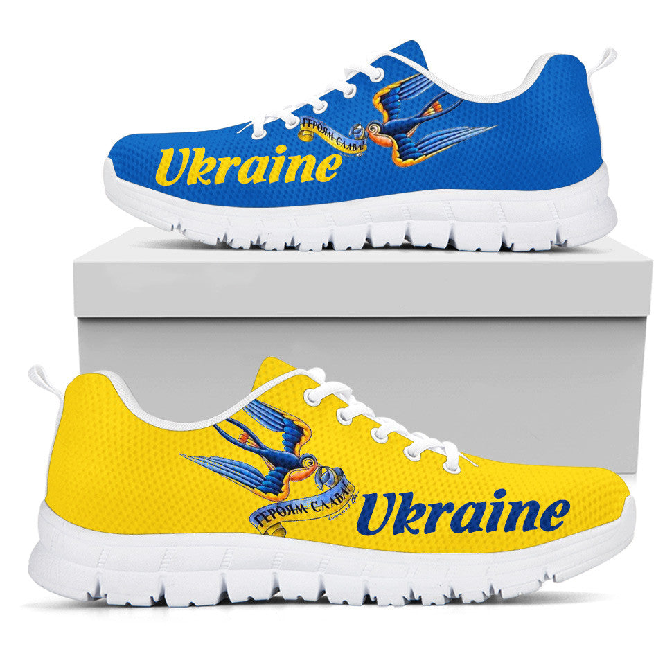 Ukraine sneakers in blue and yellow with white sole; lace-up, 'Ukraine' logo on side