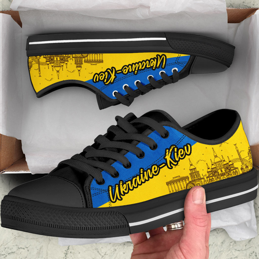 Low-top sneakers with blue laces, yellow Kyiv print, black sole