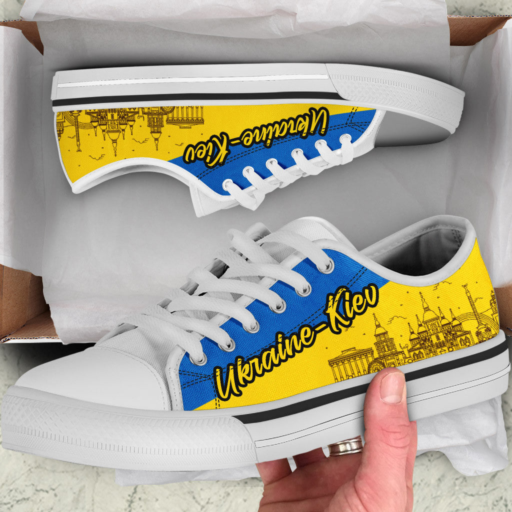 Low-top sneakers with blue laces, yellow Kyiv print, white sole