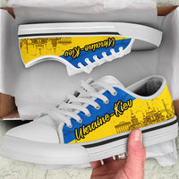 Low-top sneakers with blue laces, yellow Kyiv print, white sole