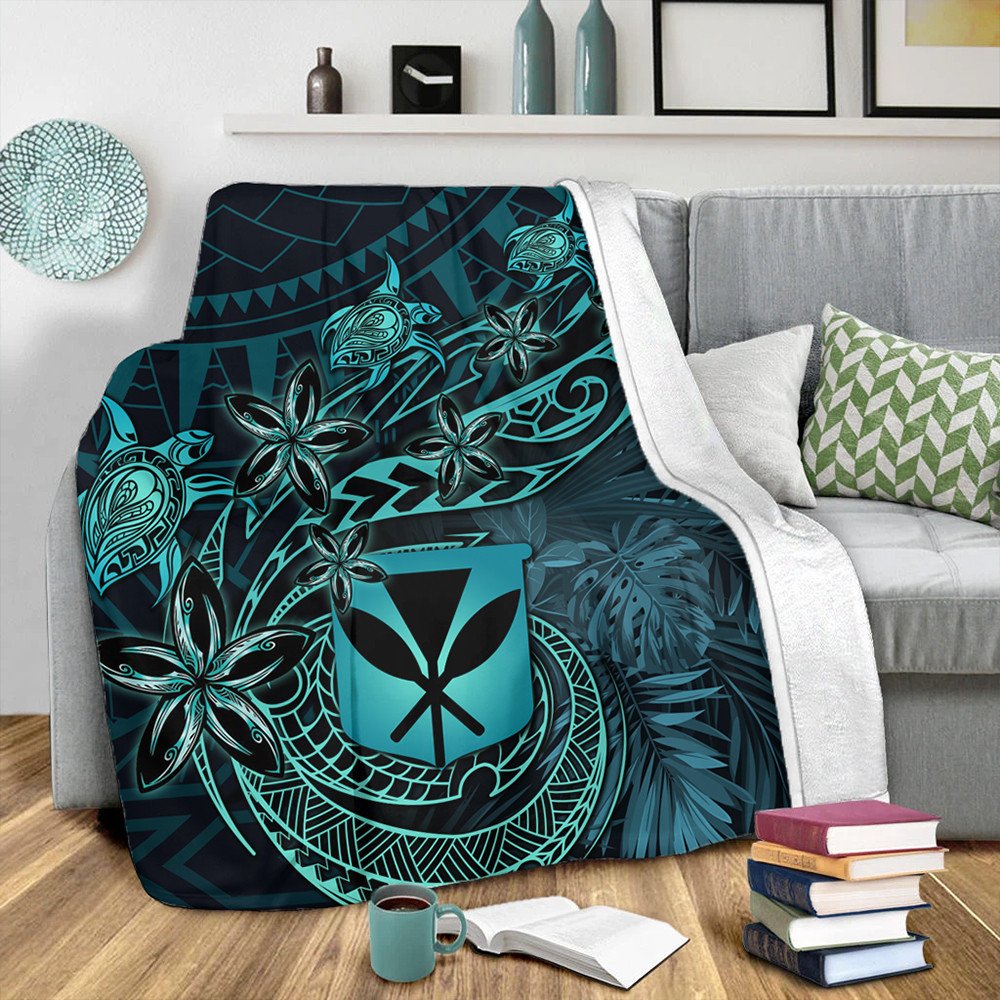 Turquoise tropical blanket with turtle, flowers, and geometric tiki motifs