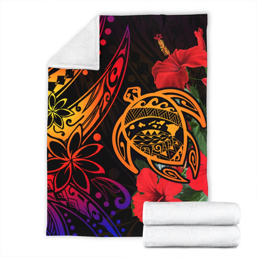 Folded Hawaiian turtle blanket with red hibiscus flowers, black background and orange tribal turtle