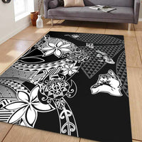 Black Hawaiian area rug with white floral, stylized animal silhouettes, and geometric tribal patterns