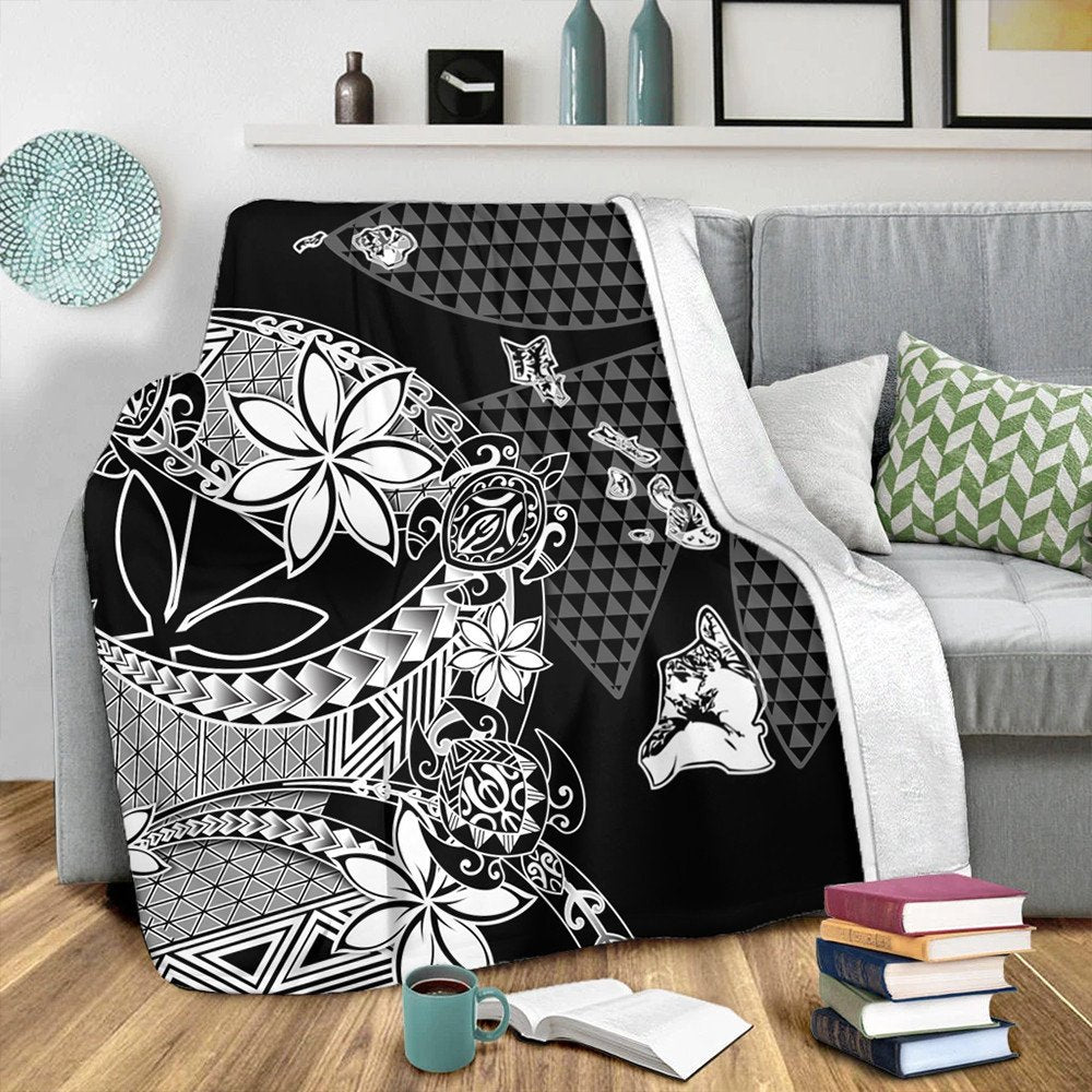 Black Hawaiian blanket with white tribal floral and geometric tiki-style motifs