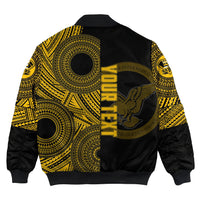Black bomber jacket back view with yellow-gold circular pattern and vertical Nanakuli text