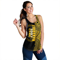 Black racerback tank with yellow tribal-style graphic and vertical yellow lettering