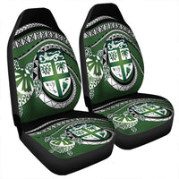 Green Polynesian turtle car seat covers with black trim and tribal shield pattern on fronts