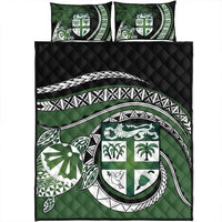 Green quilt cover with tropical shield motif and turtle emblem, quilted diamond texture