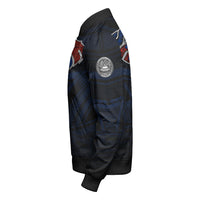 Black bomber jacket side view with sleeve circular emblem and tribal pattern