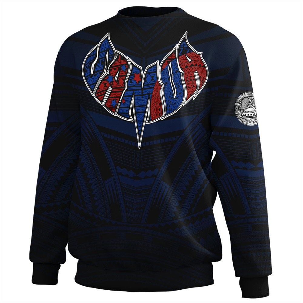 Dark crewneck sweatshirt with central V Polynesian graphic in blue and red, sleeve emblems