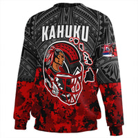 Black sweatshirt with Kahuku graphic, red camo lower, and paw icon sleeve art