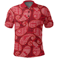 Red paisley bandana polo shirt close-up: collar, 3-button placket, all-over pattern