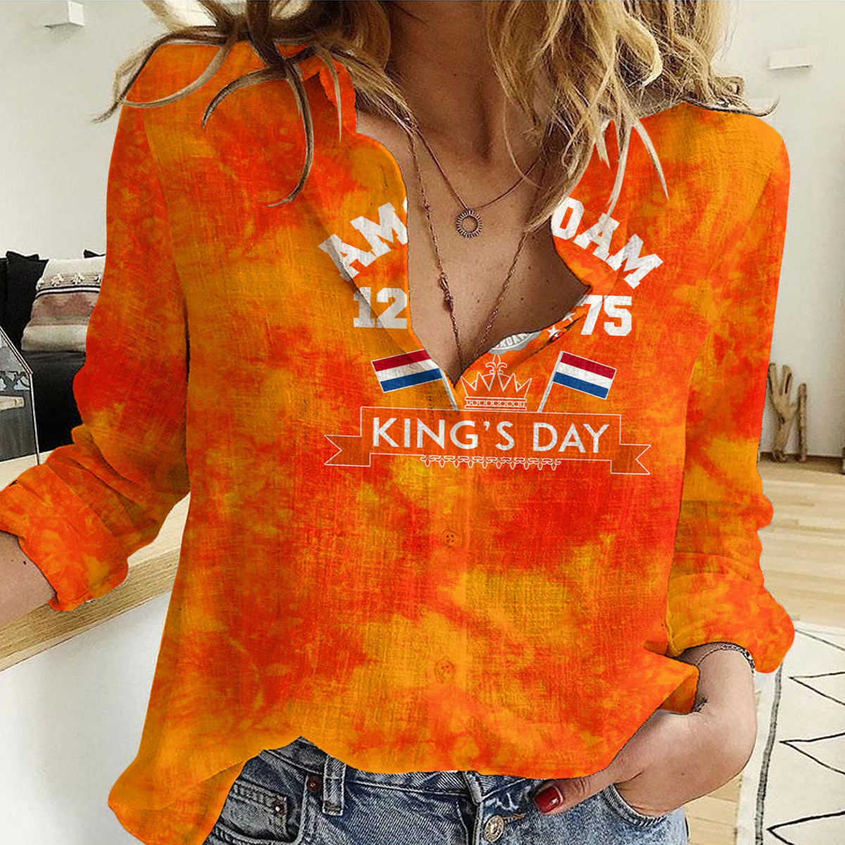 Women's orange casual shirt with long sleeves and V-neck, featuring King's Day graphic