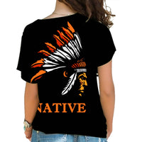 Back view: black cold-shoulder T-shirt with multicolor chief head graphic