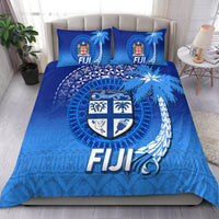 Blue Fiji bedding set with crest emblem, tribal tapa patterns, and two matching pillowcases