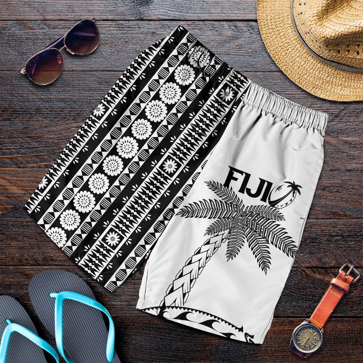 White men’s rugby shorts with black tapa and coconut tree print, elastic waist