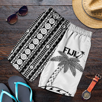 White men’s rugby shorts with black tapa and coconut tree print, elastic waist
