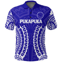 Pukapuka polo shirt blue tribal pattern with PUKAPUKA logo on front