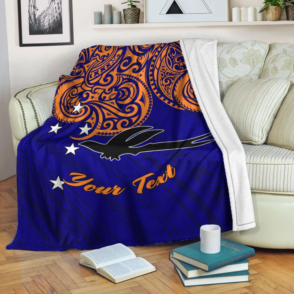 Blue pride blanket with orange swirls, white stars, black bird and “Your Text”