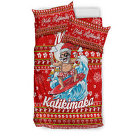 Red bedding set with surfer Santa artwork on duvet and matching “Mele Kalikimaka” pillowcases
