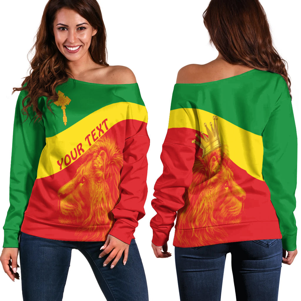 Women off-shoulder sweater, green/yellow/red Ethiopian flag lion print